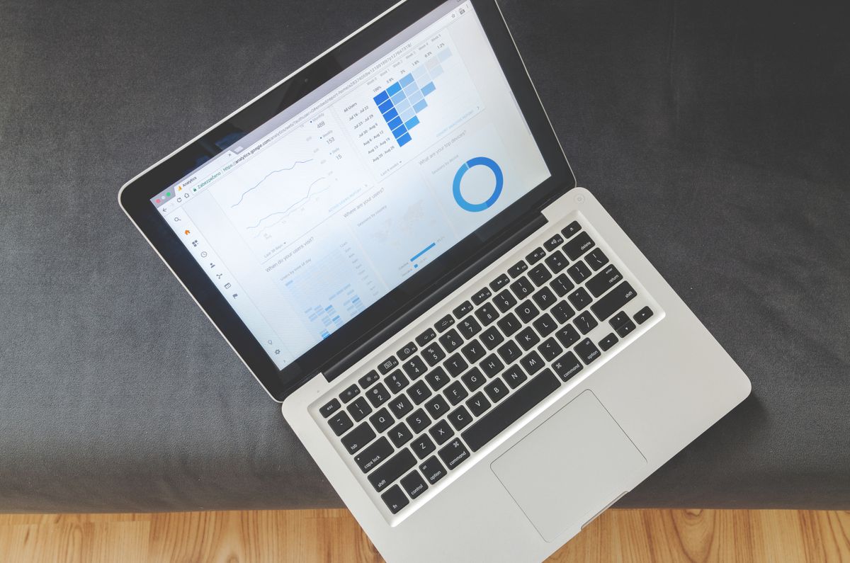 Laptop screen showing marketing data visualizations and charts