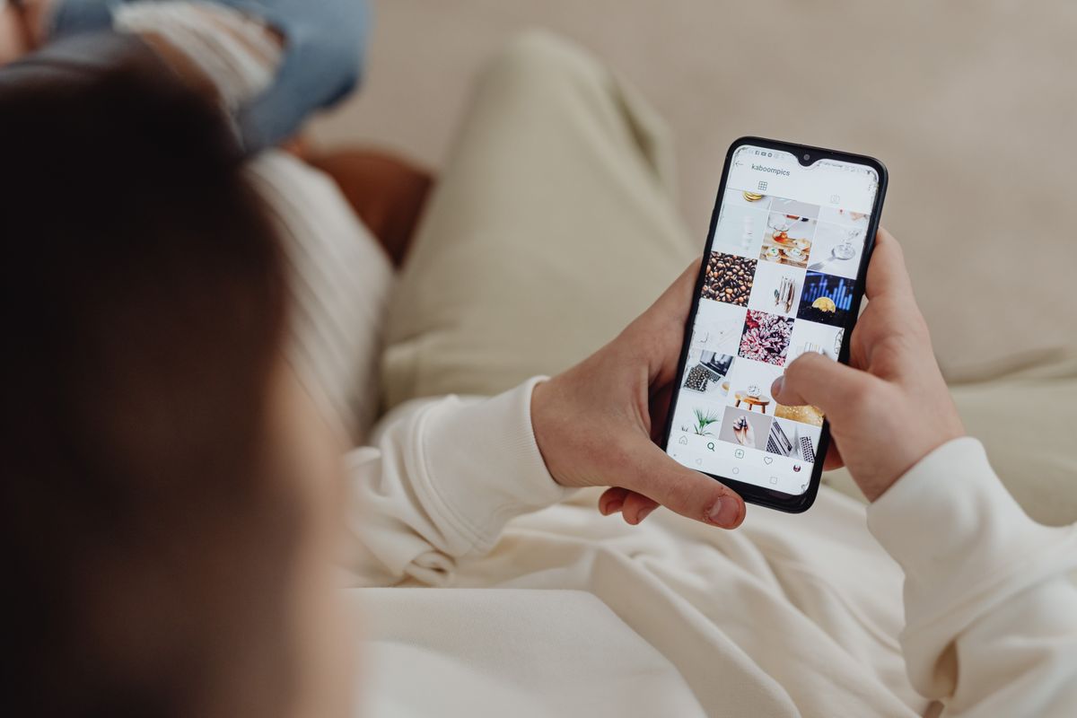 Person scrolling Instagram on a phone